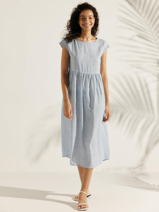 LINTICO Joan linen maxi dress with cap sleeves, washed for a relaxed look, featuring a flowing midi silhouette and natural fabric texture.