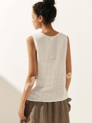 LINTICO Erin 100% linen button-down tank top in natural beige, sleeveless design with a relaxed fit, shown on a plain background.