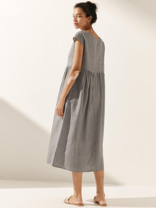 LINTICO 100% linen cap sleeve washed maxi dress with midi length, featuring a relaxed fit and natural fabric texture.