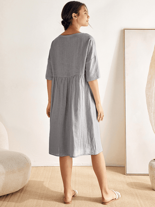 LINTICO 100% linen A-line midi dress in neutral grey, featuring a flowing silhouette and elegant design for versatile wear.