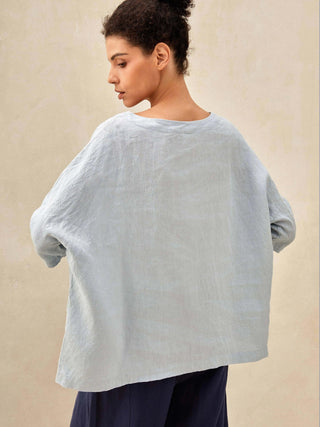 Ice blue linen boatneck top with 3/4 length sleeves from LINTICO, featuring a relaxed fit and breathable 100% linen fabric.