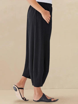 LINTICO 100% linen crop pants in charcoal black, stylish women's bottoms with a relaxed fit and lightweight linen fabric.