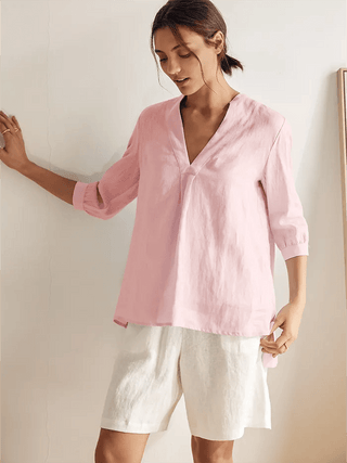 Light pink 100% linen dress shirt by LINTICO, featuring a classic blouse style with a smooth, breathable fabric.