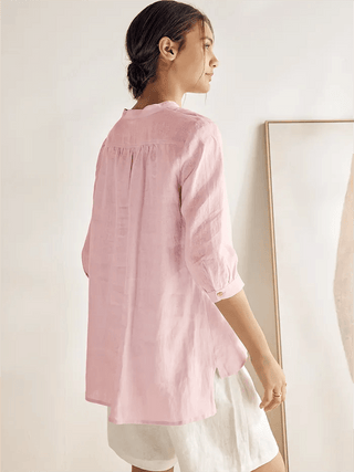 Light pink 100% linen dress shirt from LINTICO, featuring a classic blouse style and crisp, breathable fabric.