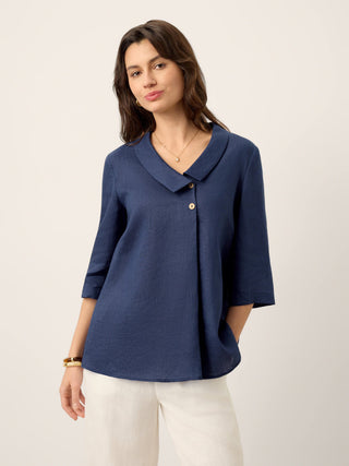 Navy blue linen long top with asymmetric collar and inverted pleat by LINTICO, showcasing a stylish, relaxed fit.