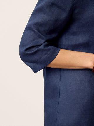 Navy blue linen long top with asymmetric collar and inverted pleat by LINTICO, featuring a relaxed fit and stylish design.