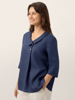 Navy blue linen long top with asymmetric collar and inverted pleats by LINTICO, showcasing a relaxed, stylish design.