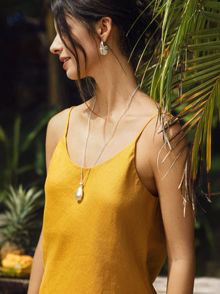 LINTICO honey yellow 100% linen camisole with beaded hem, featuring a relaxed fit and natural linen texture.