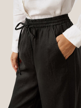 Charcoal black linen pants from LINTICO's 100% linen classic LYON collection, featuring relaxed fit and tailored design.