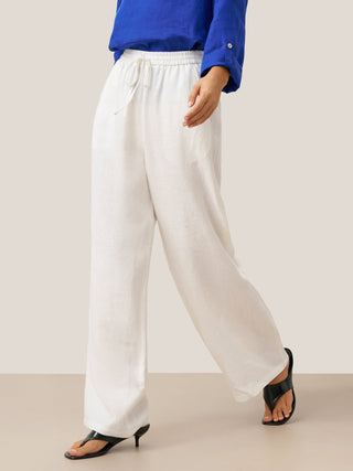 LINTICO 100% linen classic white pants in a relaxed fit, showcasing a lightweight and breathable design for comfortable wear.