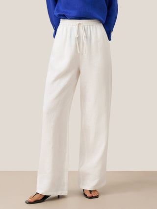 LINTICO 100% linen classic white pants with a relaxed fit, tailored waistband, and straight-leg design for versatile style.