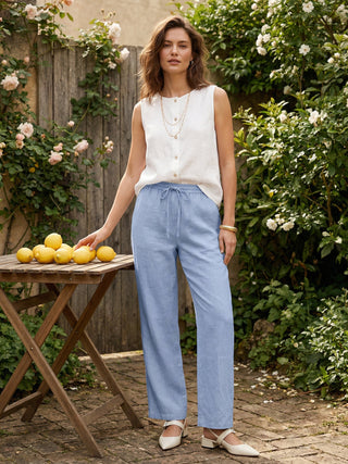 LINTICO 100% linen classic pants in Cerculean color, tailored fit, lightweight breathable fabric, shown on a model.