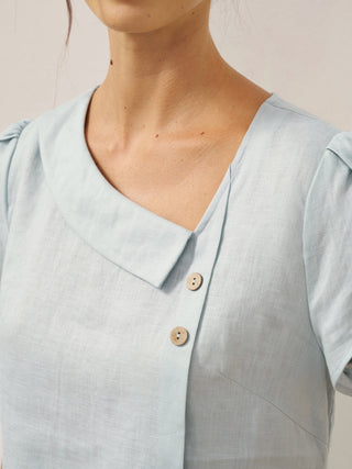Aqua blue linen blouse with a crescent collar and flutter sleeves by LINTICO, featuring a relaxed, breathable design.