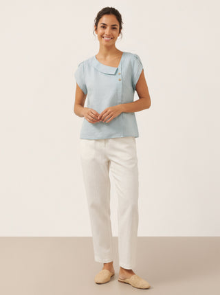 Aqua blue linen blouse with crescent collar and flutter sleeves by LINTICO, featuring a relaxed fit and lightweight fabric.