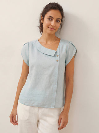 Aqua blue linen top with a crescent collar and flutter sleeves by LINTICO, featuring a relaxed fit and lightweight fabric.