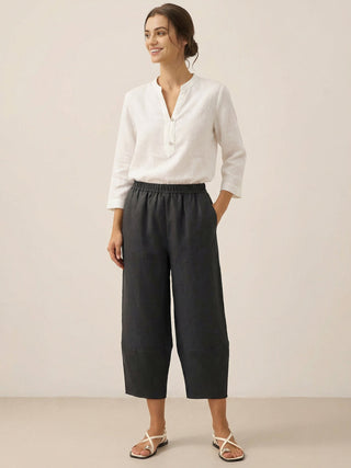 LINTICO 100% linen crop pants Rory in charcoal black, featuring a relaxed fit and lightweight breathable fabric.