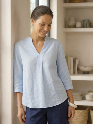 Ice blue linen dress shirt for women by LINTICO, featuring a relaxed fit and classic button-up style.