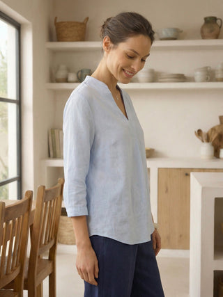 Light blue 100% linen dress shirt for women, Joanna style, by LINTICO, featuring a classic blouse fit and smooth fabric texture.