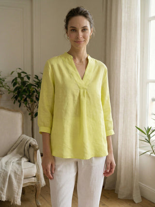Lemon yellow 100% linen Joanna dress shirt by LINTICO, displayed on a flat lay with collar and button details.