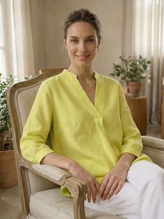 LINTICO Joanna linen dress shirt in lemon yellow, featuring a classic blouse design with a collar and button-up front.