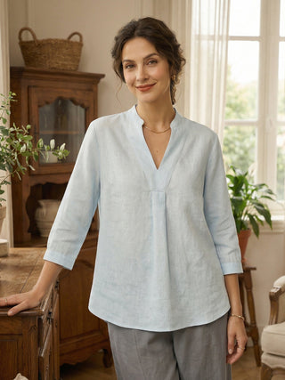 LINTICO Joanna 100% linen dress shirt in Mist Blue, featuring a classic blouse style with a relaxed fit and natural fabric texture.