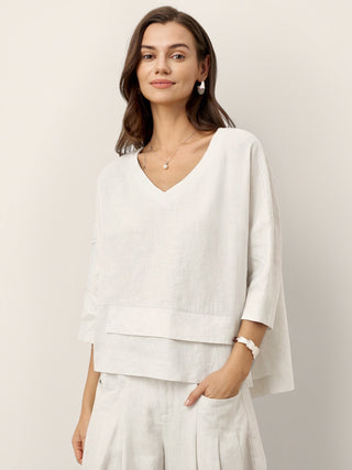 Optic white linen drop shoulder layered hem overtop shirt by LINTICO, featuring asymmetric design and relaxed fit.
