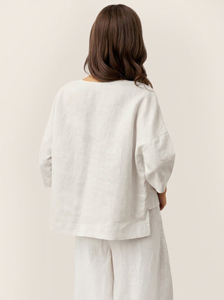 Optic white linen drop shoulder layered hem overtop shirt by LINTICO, featuring asymmetric design and relaxed fit.