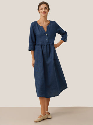 Navy blue linen maxi dress by LINTICO featuring a loose fit, button waist, and gathered design for a relaxed, elegant look.