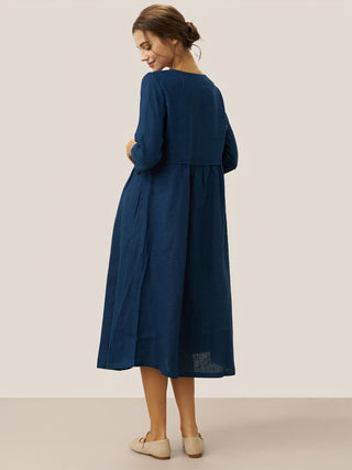 Navy blue linen maxi dress with loose fit, button waist, and gathered design by LINTICO, perfect for casual summer wear.