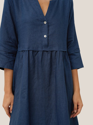 Navy blue linen maxi dress with a loose fit, button waist, and gathered details by LINTICO, perfect for casual summer wear.