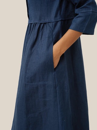 Navy blue linen maxi dress by LINTICO with a loose fit, button waist, and gathered fabric, perfect for casual summer wear.