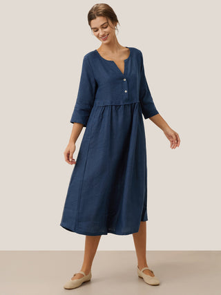 Navy blue linen maxi dress with loose fit, button waist, and gathered detail from LINTICO, perfect for casual summer wear.