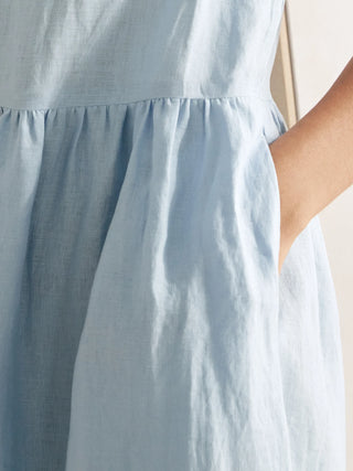 Baby blue 100% linen A-line midi dress from LINTICO's VALENCIA collection, featuring a flowing silhouette and elegant design.