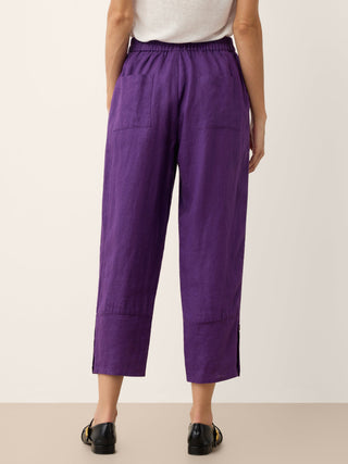 Dark purple 100% linen artisan button tapered pants by LINTICO, styled with a relaxed fit and tailored design.