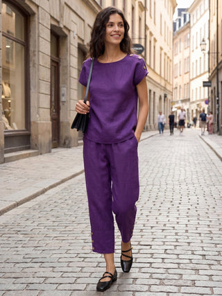 Dark purple 100% linen artisan button tapered pants by LINTICO, featuring a relaxed fit and tailored design.