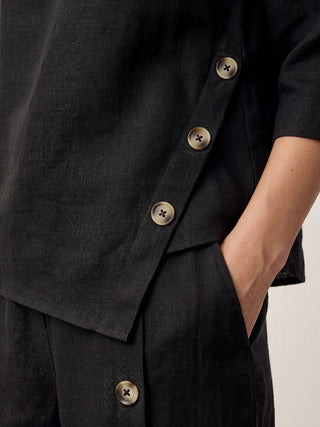 LINTICO 100% linen asymmetrical-hem button-trim top in charcoal black, featuring a stylish, modern design.