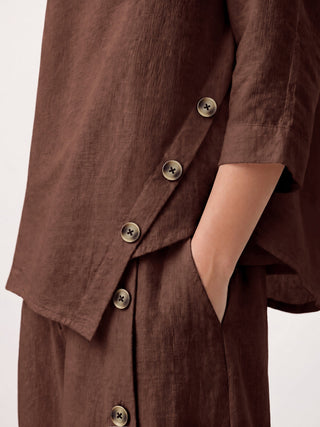 LINTICO 100% linen asymmetric-hem button-trim top in espresso brown, styled as a casual women's top.