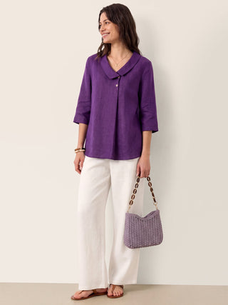 Dark purple linen long top with asymmetric collar and inverted pleats by LINTICO, featuring a stylish, relaxed fit.