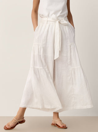 LINTICO 100% linen bow-waist tiered pants TARYN in optic white, showing the relaxed fit and flowing, tiered design.