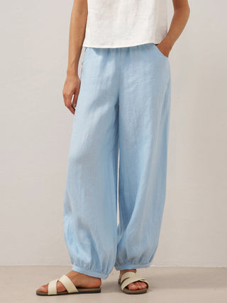 Baby blue Linen pants with broad elastic waistband by LINTICO, featuring a relaxed fit and lightweight breathable fabric.