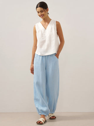 Baby blue linen pants with a broad elastic waistband from LINTICO's TALIA collection, featuring a relaxed fit and breathable fabric.