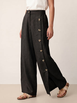 LINTICO Katya 100% linen buttoned slit-hem pants in charcoal black, featuring a relaxed fit and stylish design.