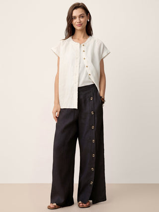 LINTICO charcoal black linen pants with buttoned slit hem, featuring a relaxed fit and casual style.