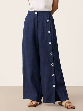Navy blue linen pants with buttoned slit hem from LINTICO's KATYA collection, featuring a relaxed fit and stylish design.