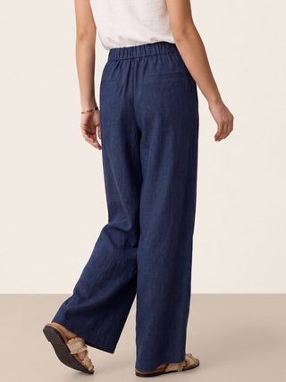 Navy blue linen buttoned slit-hem pants by LINTICO, featuring a relaxed fit and stylish design, displayed on a model.
