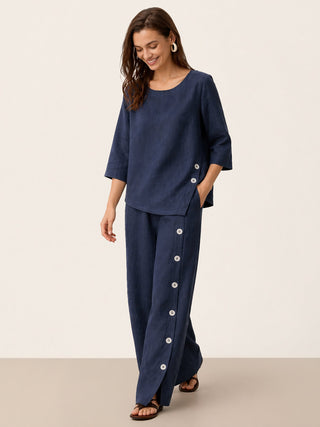 Navy blue linen buttoned slit-hem pants by LINTICO, featuring a relaxed fit and stylish design, perfect for casual or work wear.