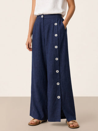 Navy blue linen pants with buttoned slit-hem from LINTICO KATYA, featuring a relaxed fit and stylish design.