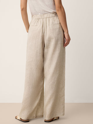 LINTICO Katya 100% linen buttoned slit-hem pants in stone oat color, stylish casual bottoms with relaxed fit and side slit detail.