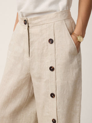 LINTICO Katya 100% linen buttoned slit-hem pants in stone oat color, casual breathable bottoms with relaxed fit and slit detail.
