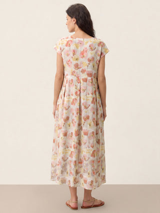 Linen maxi dress with carnation print and scalloped waist from LINTICO, featuring a flowing design and garden blush color.